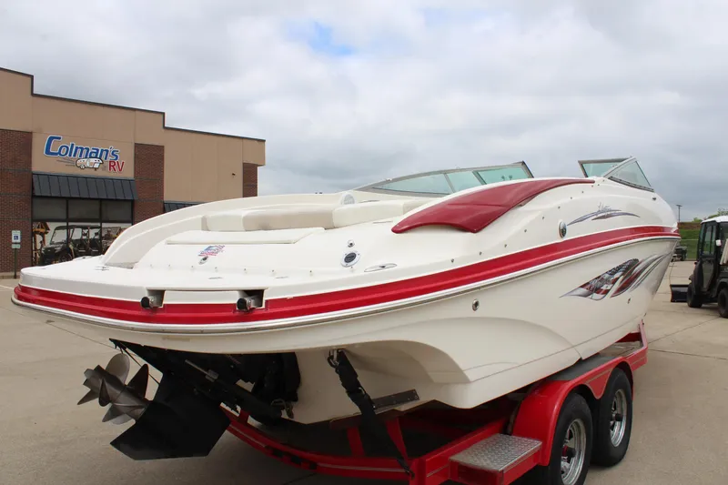 Slide: The Image of 2007 Rinker 246 Captiva Bowrider on red trailer at dealership. - 14