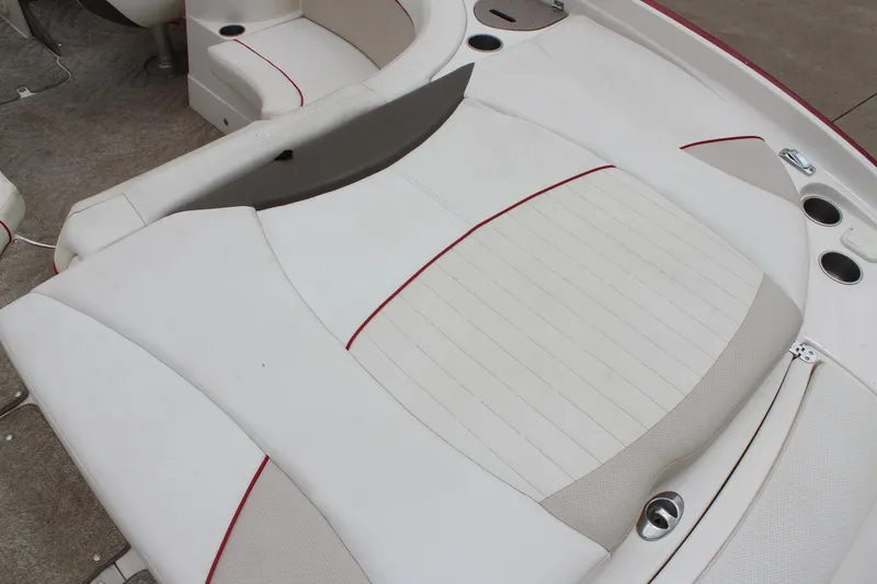 Slide: The Image of 2007 Rinker 246 Captiva Bowrider interior with white and red seating. - 16