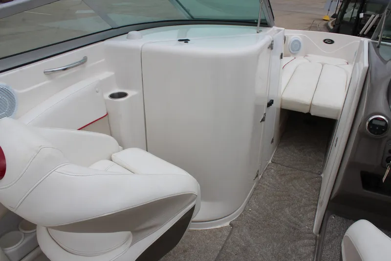 Slide: The Image of 2007 Rinker 246 Captiva Bowrider interior with white seating and modern design. - 24