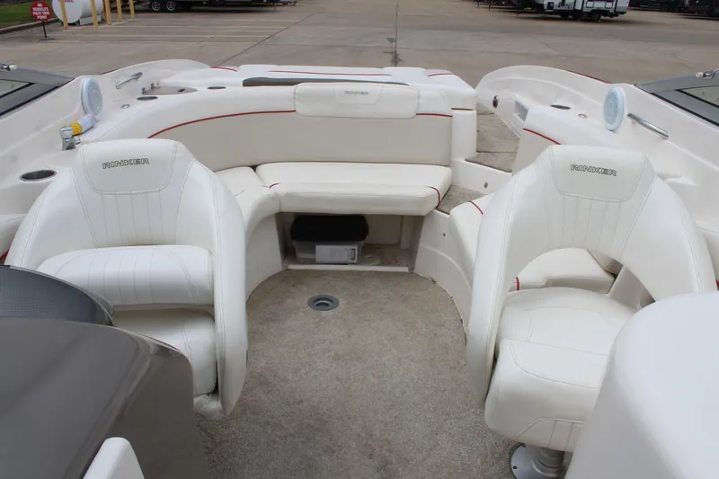 Slide: The Image of 2007 Rinker 246 Captiva Bowrider interior with white seating and spacious layout. - 29