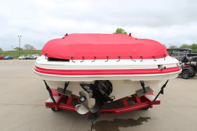 Slide: The Image of 2007 Rinker 246 Captiva Bowrider with red cover on trailer, rear view. - 6