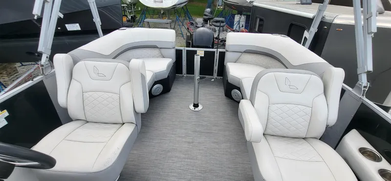Slide: The Image of 2022 Lowe SS 210 boat interior with plush white seating and modern design. - 2