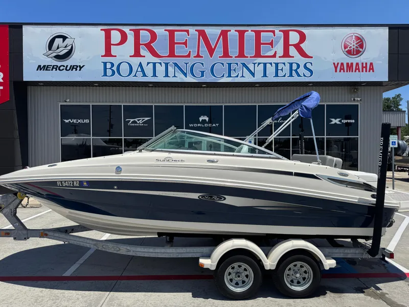 Slide: The Image of 2010 Sea Ray 220 Sundeck boat on trailer at Premier Boating Centers. - 1