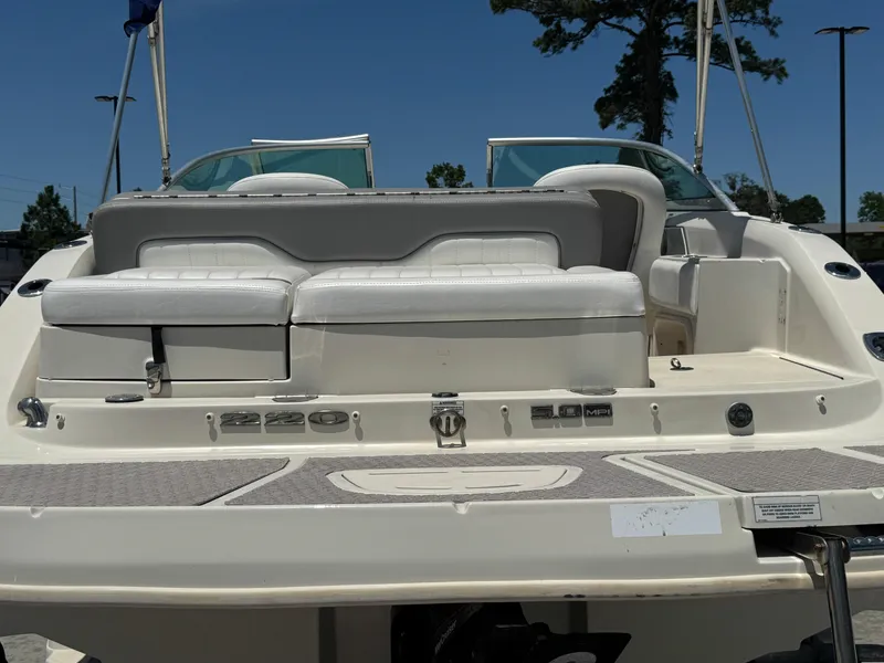 Slide: The Image of 2010 Sea Ray 220 Sundeck boat, rear view with seating and deck details. - 14