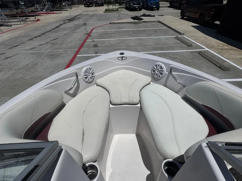 Slide: The Image of Bow seating area of a 2015 TAHOE - WRMG Q7I boat in a parking lot. - 14