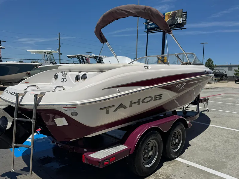 Slide: The Image of 2015 TAHOE Q7I boat on trailer in sunny parking lot. - 26