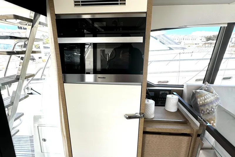 Slide: The Image of Interior of 2019 Prestige 460 Fly Bridge yacht with modern kitchen appliances. - 13