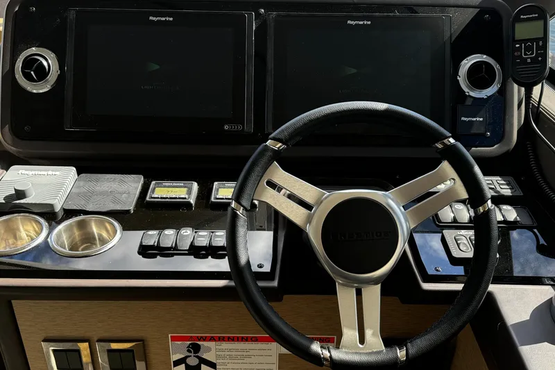 Slide: The Image of Steering wheel and control panel of 2019 Prestige 460 Fly Bridge yacht. - 17