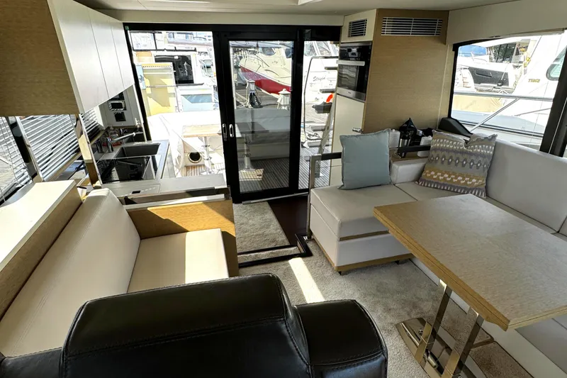 Slide: The Image of Interior of 2019 Prestige 460 Fly Bridge yacht with modern seating and dining area. - 20