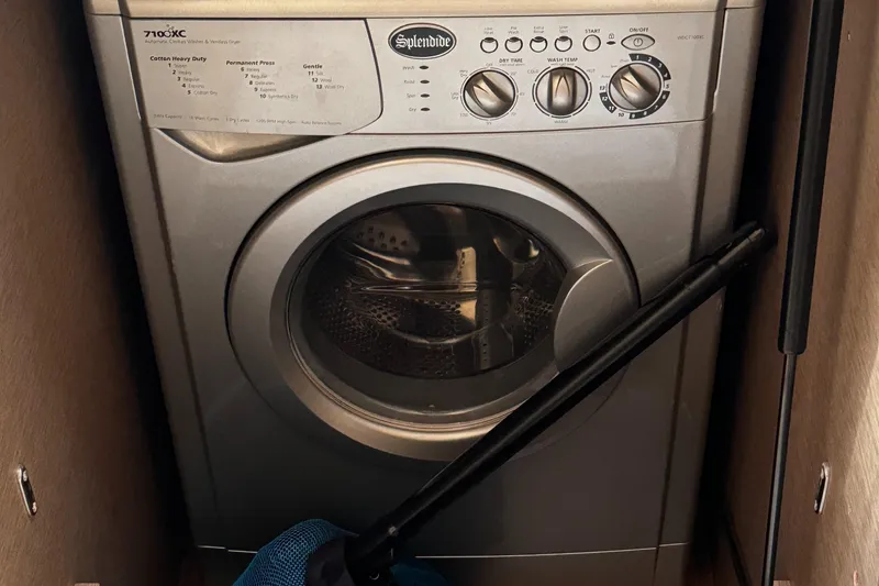 Slide: The Image of Washing machine inside a 2019 Prestige 460 Fly Bridge yacht compartment. - 38