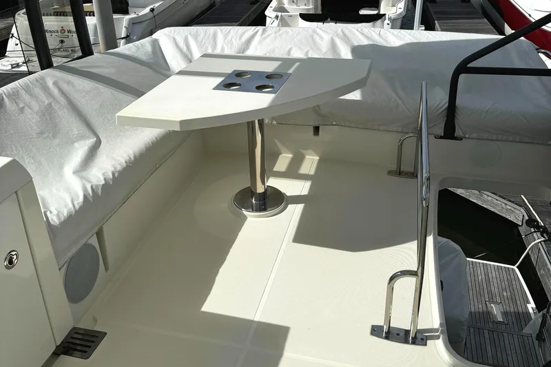 Slide: The Image of 2019 Prestige 460 Fly Bridge yacht with sleek deck and modern table design. - 42