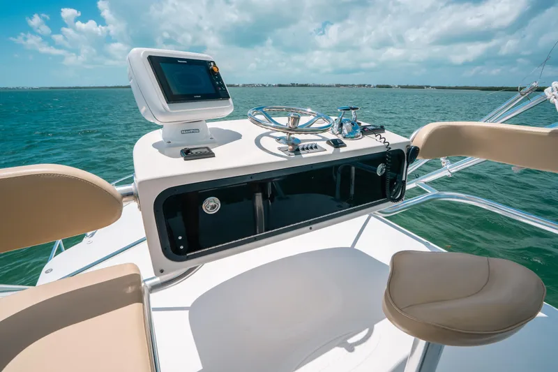 Slide: The Image of Helm of 2007 Rampage 38 Express boat with ocean view and navigation equipment. - 11