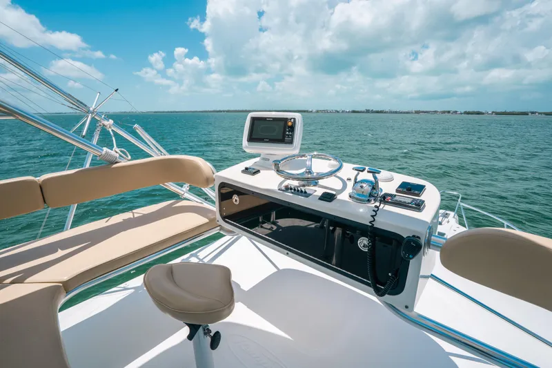 Slide: The Image of 2007 Rampage 38 Express boat helm with ocean view and clear sky. - 13