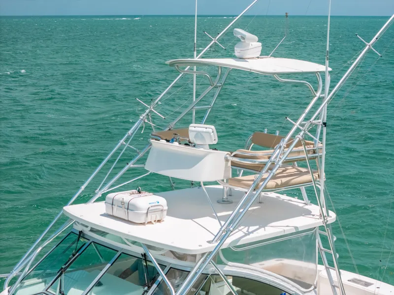 Slide: The Image of 2007 Rampage 38 Express boat on open sea with fishing tower and equipment. - 16