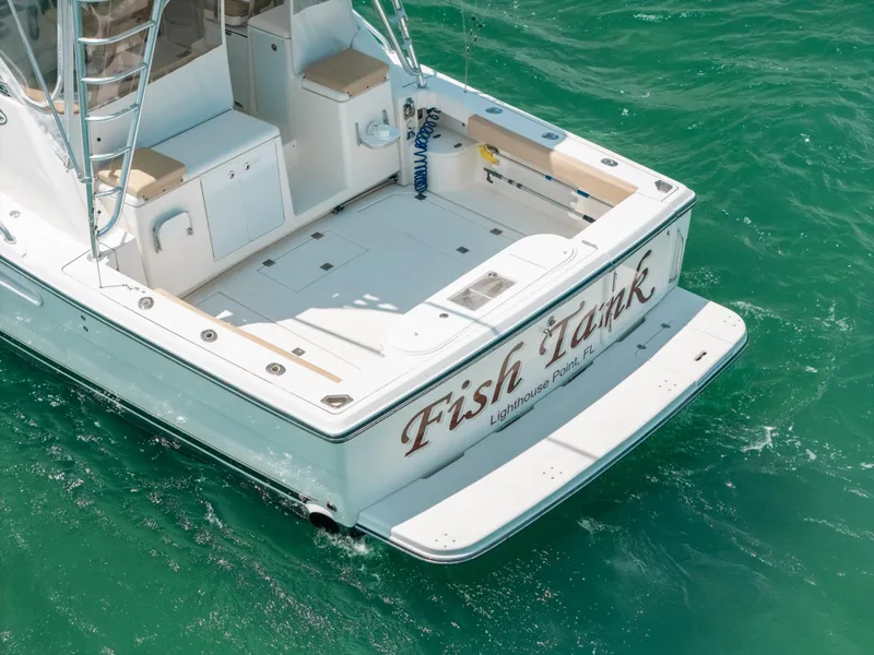 Slide: The Image of 2007 Rampage 38 Express boat on turquoise water, rear view. - 18