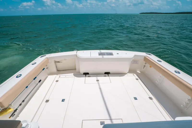 Slide: The Image of 2007 Rampage 38 Express boat deck with ocean view under clear blue sky. - 20