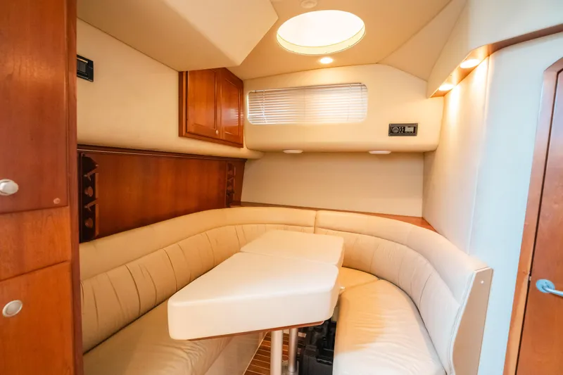 Slide: The Image of Luxurious interior of 2007 Rampage 38 Express yacht with cozy seating and elegant wood finishes. - 31