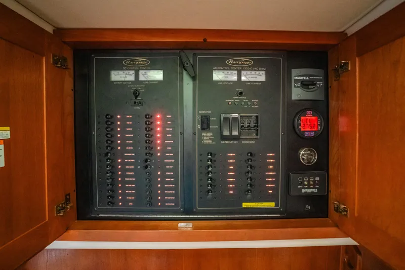 Slide: The Image of Electrical panel of a 2007 Rampage 38 Express boat, featuring switches and indicators. - 35