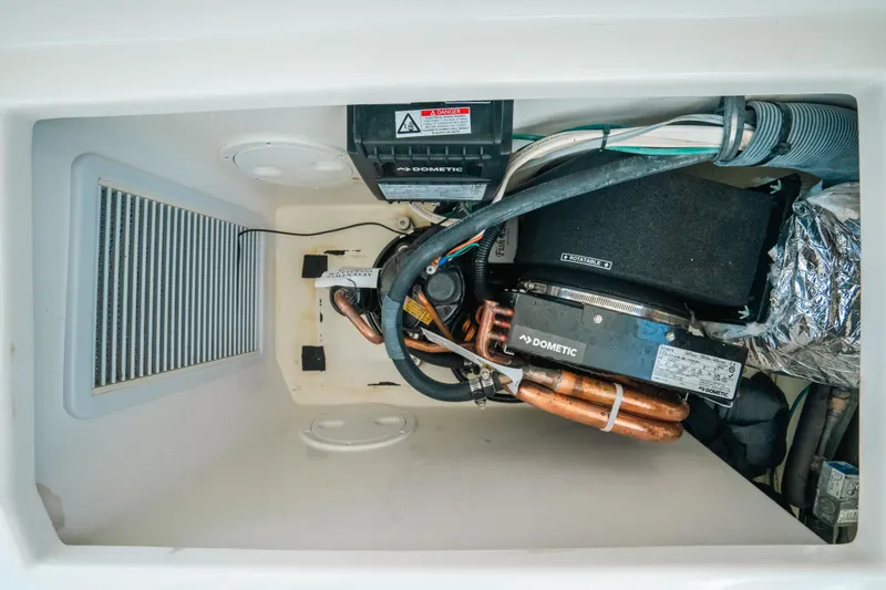 Slide: The Image of 2007 Rampage 38 Express engine compartment with wiring and components. - 36