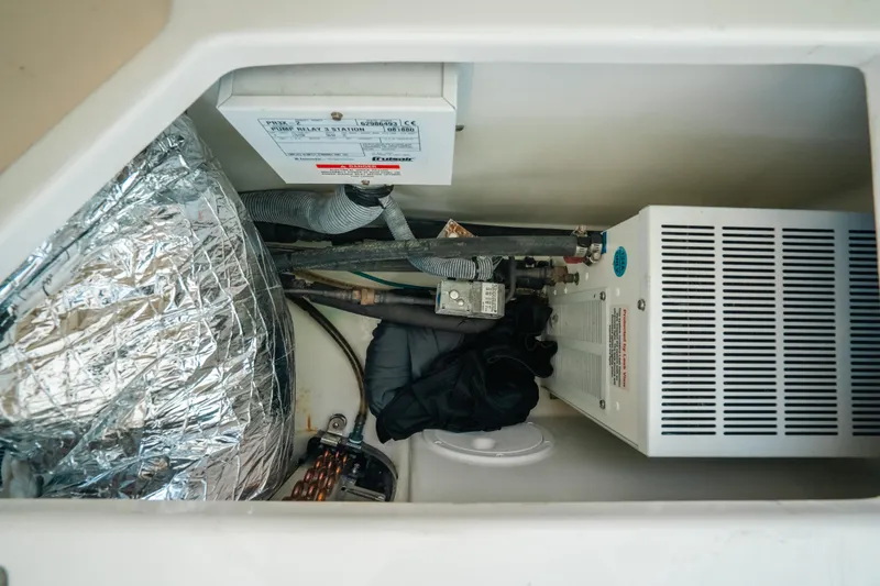 Slide: The Image of 2007 Rampage 38 Express engine compartment with wiring and insulation. - 37