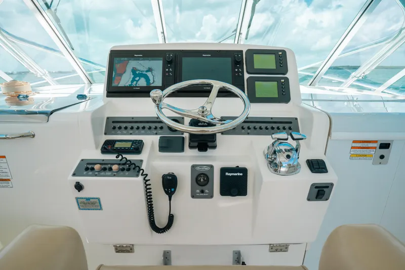 Slide: The Image of 2007 Rampage 38 Express helm with navigation controls and steering wheel. - 4