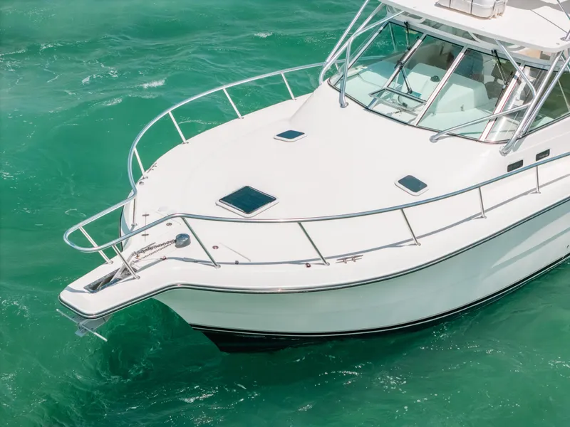 Slide: The Image of 2007 Rampage 38 Express boat on turquoise water, aerial view. - 40