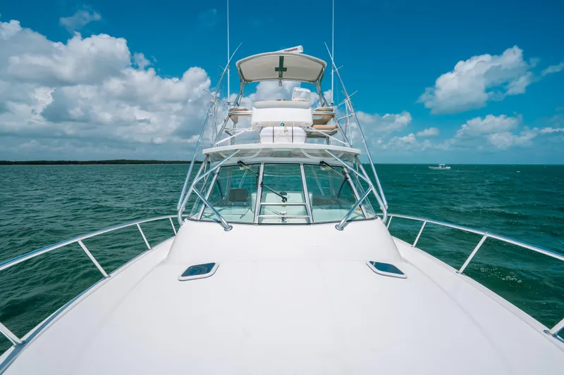 Slide: The Image of 2007 Rampage 38 Express boat on open sea under blue sky. - 41