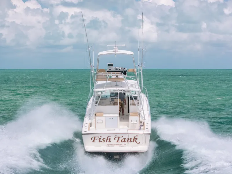 Slide: The Image of 2007 Rampage 38 Express boat cruising on open water, rear view. - 45