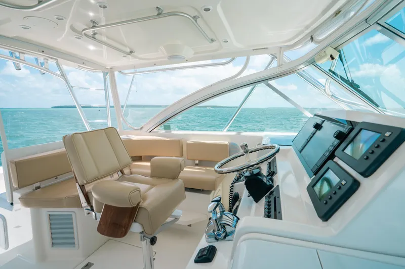 Slide: The Image of Luxurious 2007 Rampage 38 Express yacht interior with ocean view and modern navigation equipment. - 5