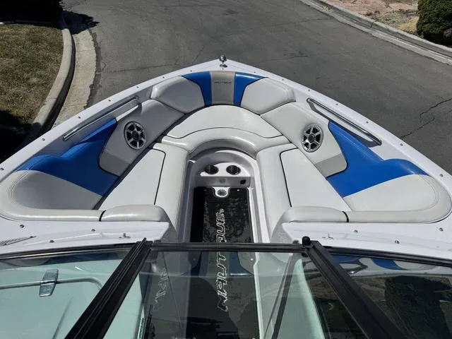 Slide: The Image of 2008 Nautique 230 TEAM EDITION boat interior with blue and white seating and speakers. - 13