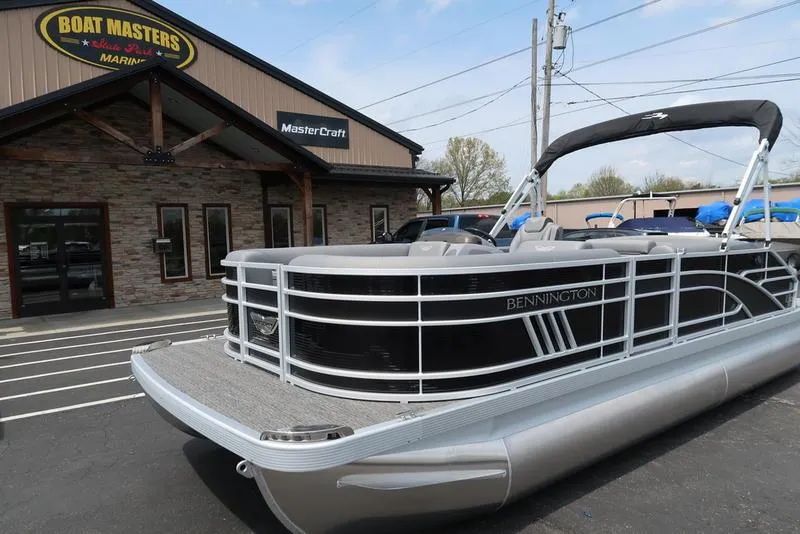 Slide: The Image of 2025 Bennington L Swingback 23 LSB pontoon boat at Boat Masters dealership. - 1