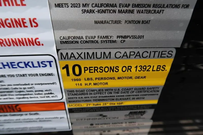 Slide: The Image of 2025 Bennington L Swingback 23 LSB capacity label: 10 persons or 1392 lbs, 116 HP motor. - 11