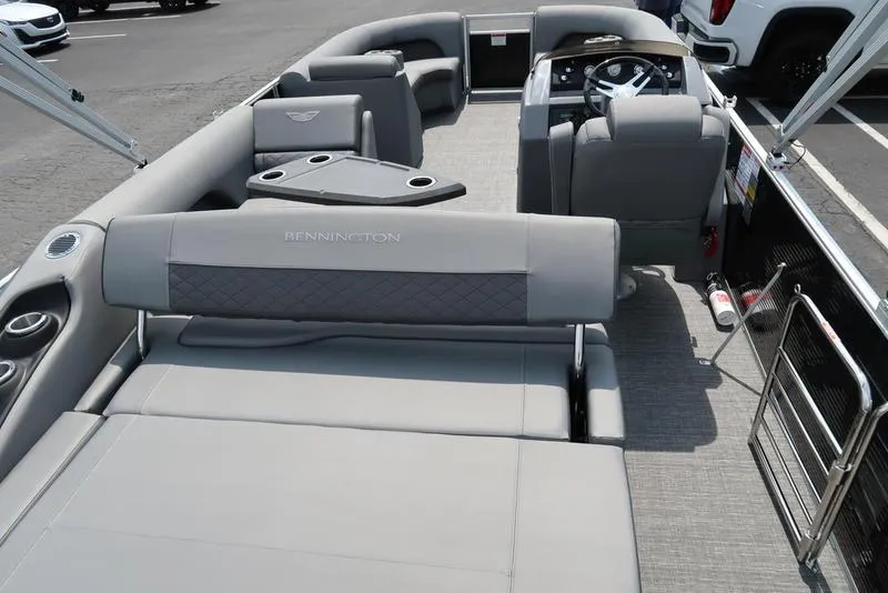 Slide: The Image of 2025 Bennington L Swingback 23 LSB pontoon boat with luxurious gray seating and modern design. - 3