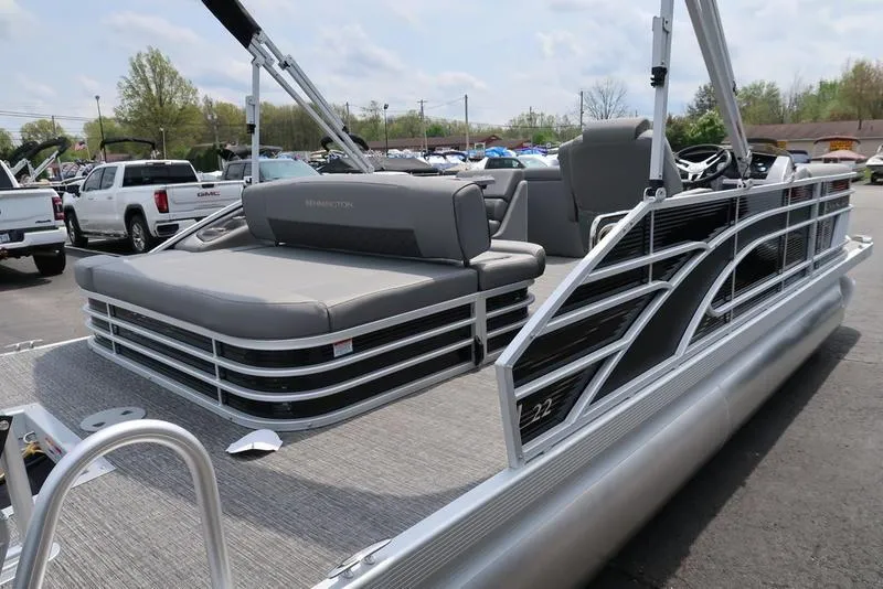 Slide: The Image of 2025 Bennington L Swingback 23 LSB pontoon boat with sleek design and comfortable seating. - 4