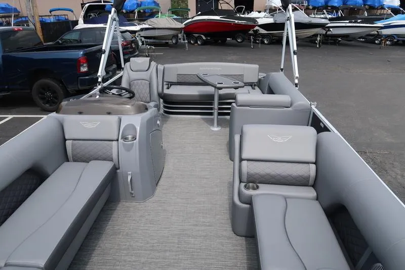 Slide: The Image of 2025 Bennington L Swingback 23 LSB pontoon boat with luxurious gray seating and modern design. - 7