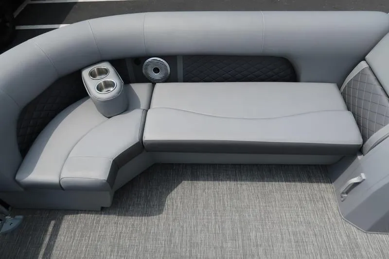 Slide: The Image of 2025 Bennington L Swingback 23 LSB boat interior with gray seating and cup holders. - 8