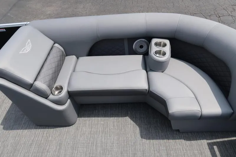 Slide: The Image of Luxurious seating on 2025 Bennington L Swingback 23 LSB pontoon boat, featuring cup holders and premium upholstery. - 9