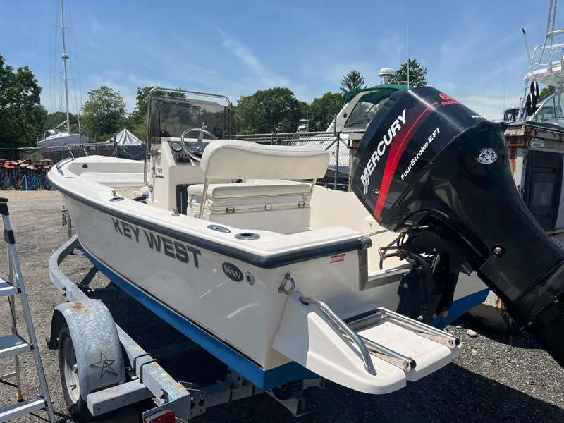 Slide: The Image of 2006 Key West 1720 Center Console boat with Mercury engine on trailer. - 1