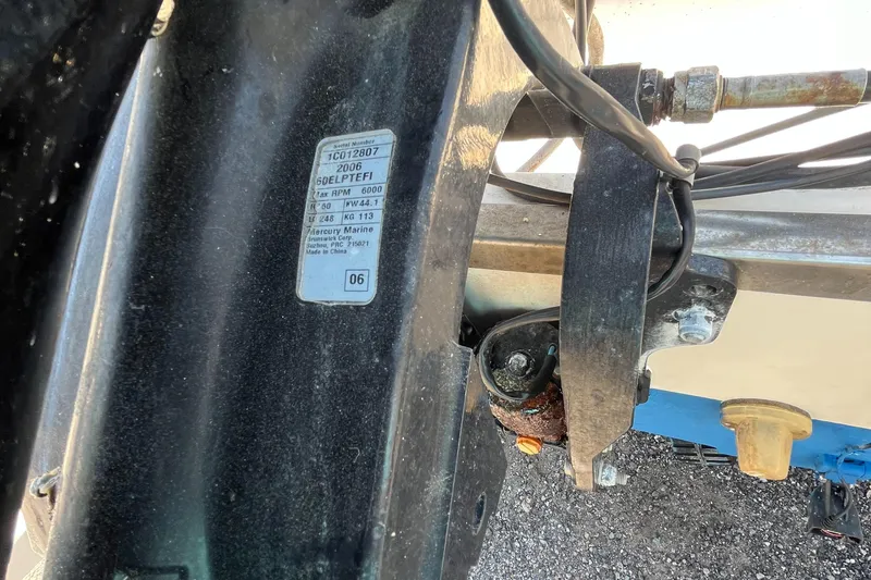 Slide: The Image of Close-up of a 2006 Key West 1720 Center Console boat component with visible label and wiring. - 10