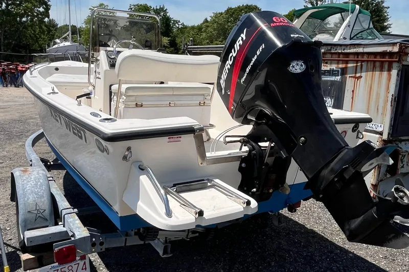 Slide: The Image of 2006 Key West 1720 Center Console boat with Mercury outboard motor on trailer. - 14