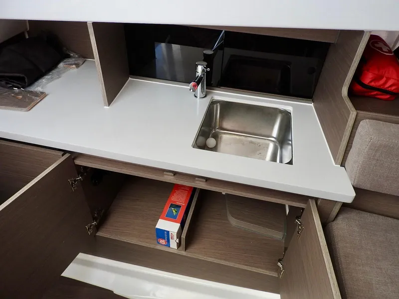 Slide: The Image of Modern kitchen area in 2023 Beneteau Flyer 9 SUNdeck boat with sink and storage. - 14