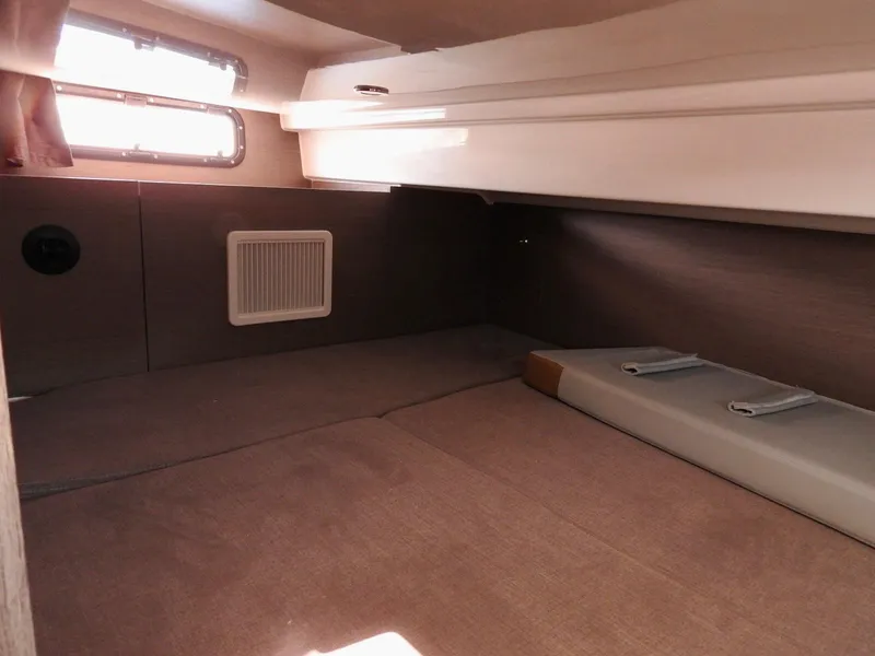 Slide: The Image of 2023 Beneteau Flyer 9 SUNdeck cabin interior with cozy sleeping area and natural light. - 16