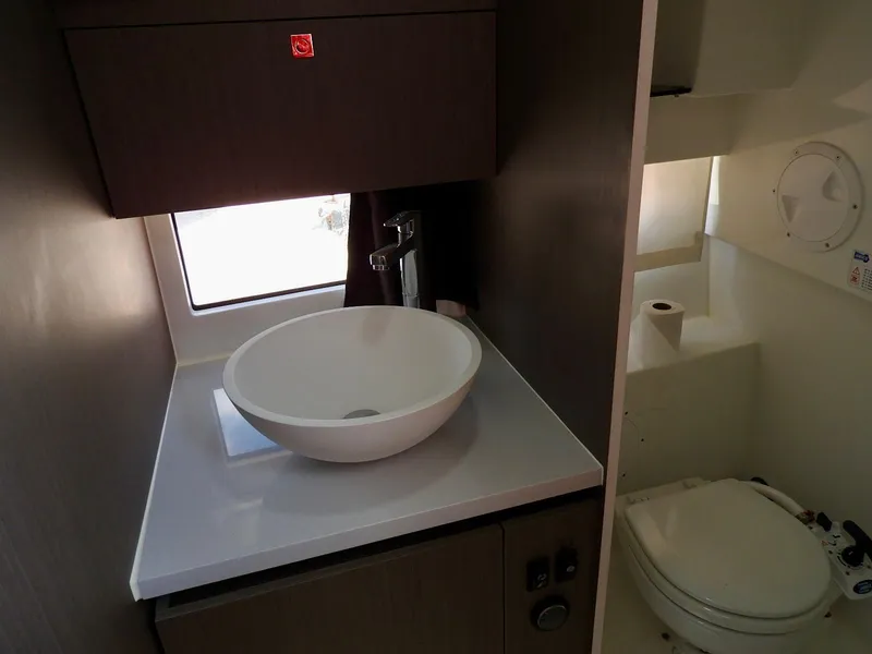 Slide: The Image of 2023 Beneteau Flyer 9 SUNdeck bathroom with modern sink and toilet. - 18