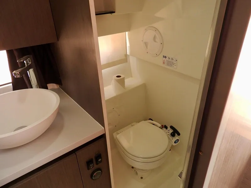 Slide: The Image of 2023 Beneteau Flyer 9 SUNdeck bathroom with modern sink and compact toilet. - 19