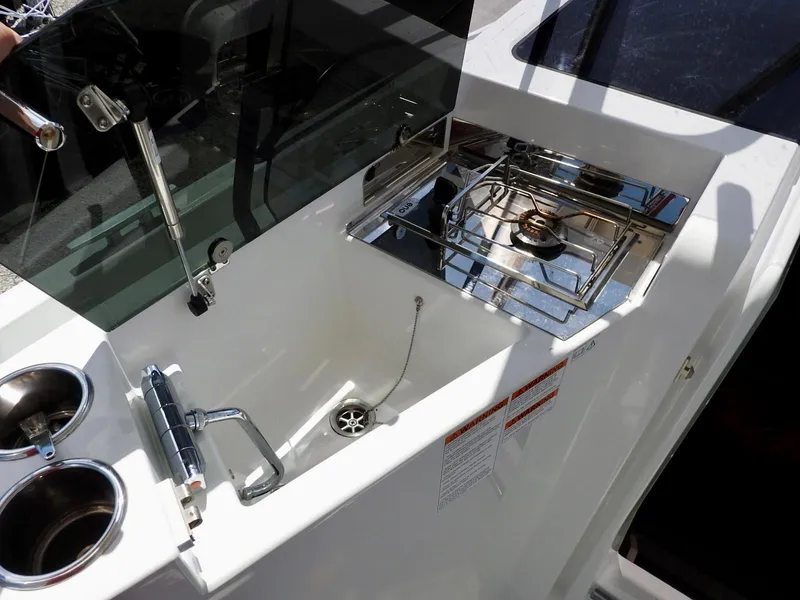 Slide: The Image of 2023 Beneteau Flyer 9 SUNdeck boat kitchen area with sink and stove. - 21