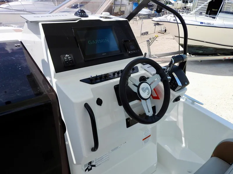 Slide: The Image of 2023 Beneteau Flyer 9 SUNdeck helm with Garmin navigation system and steering wheel. - 26