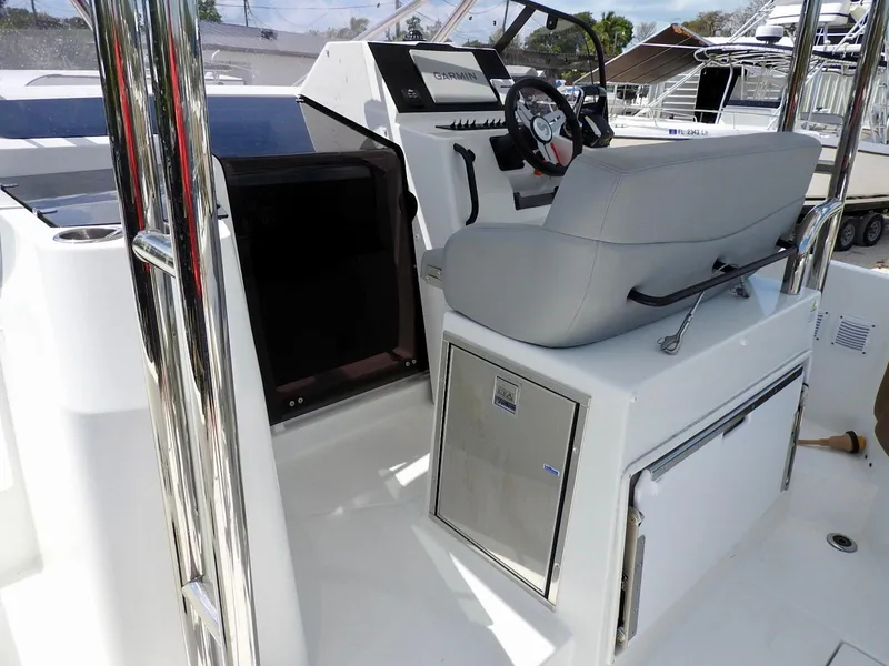 Slide: The Image of 2023 Beneteau Flyer 9 SUNdeck cockpit with steering wheel and seating area. - 27