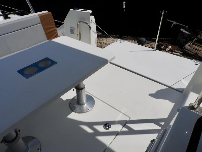 Slide: The Image of 2023 Beneteau Flyer 9 SUNdeck boat deck with table and seating area. - 28