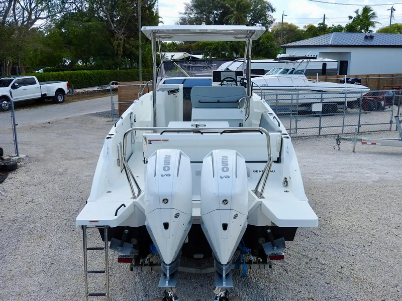 Slide: The Image of 2023 Beneteau Flyer 9 SUNdeck with dual outboard engines, parked in a marina. - 33