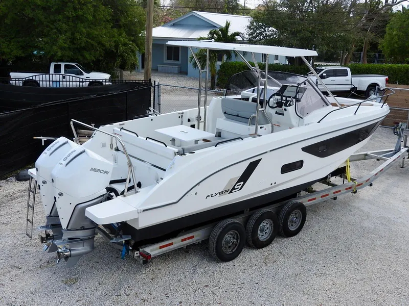 Slide: The Image of 2023 Beneteau Flyer 9 SUNdeck boat on trailer, featuring sleek design and powerful engines. - 34